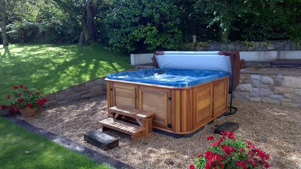 Opened Arctic Spas Hot tub in the backyard