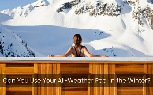 woman in all weather pool looking at mountain in winter